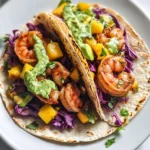 Spicy Shrimp Tacos with Mango Slaw and Avocado Crema